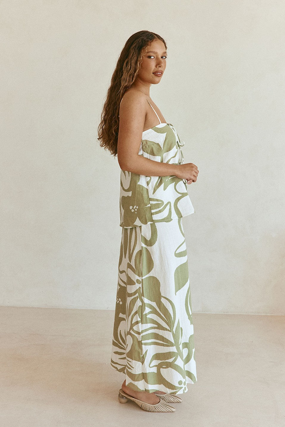 Green maxi dress with an A-line skirt, side view