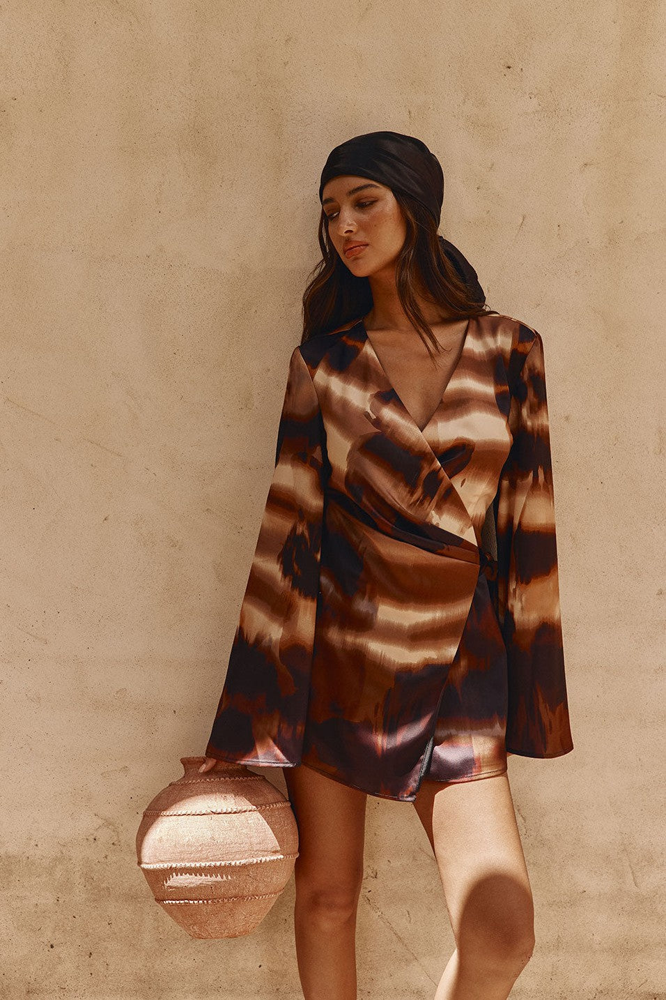 Brown mini dress with a wrap silhouette, front view
