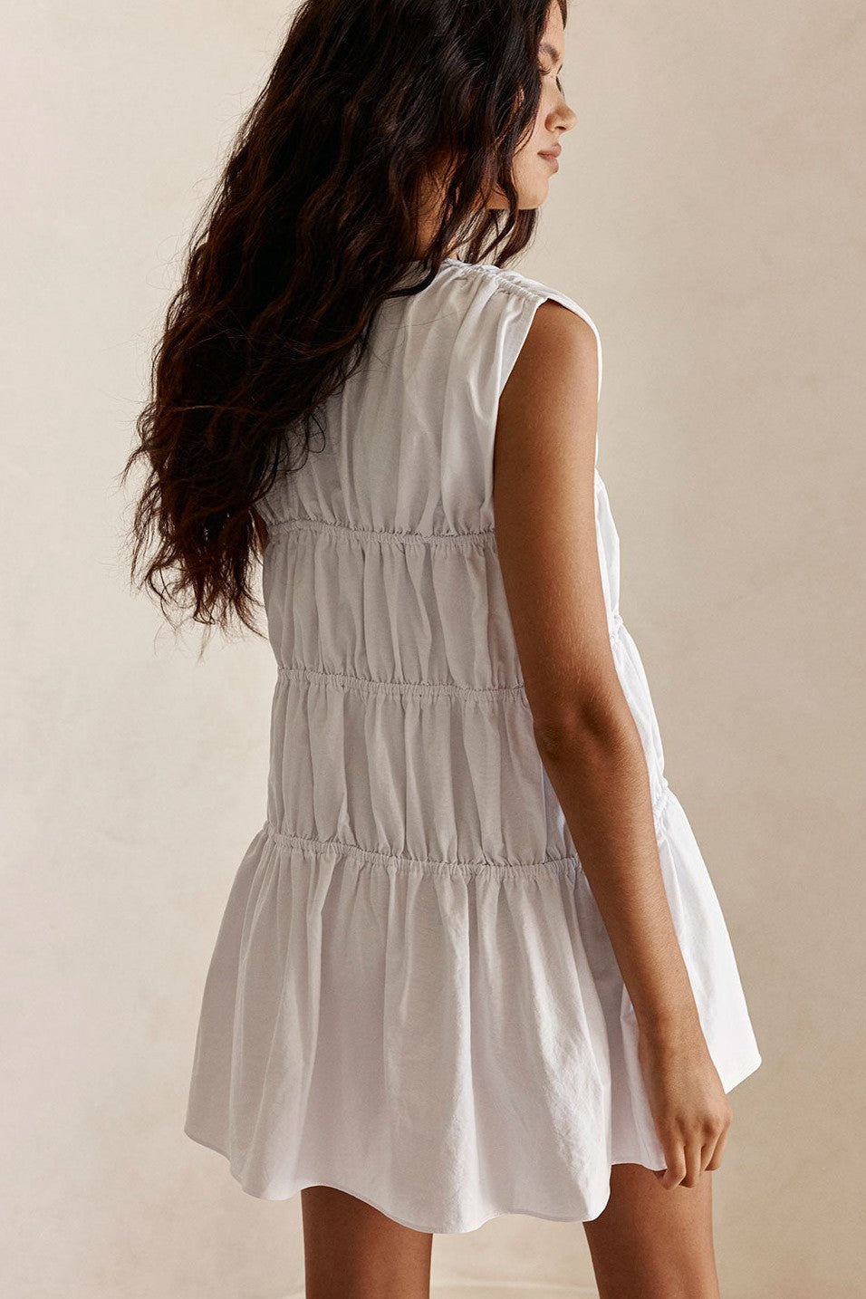 White mini dress with a V neckline, front view