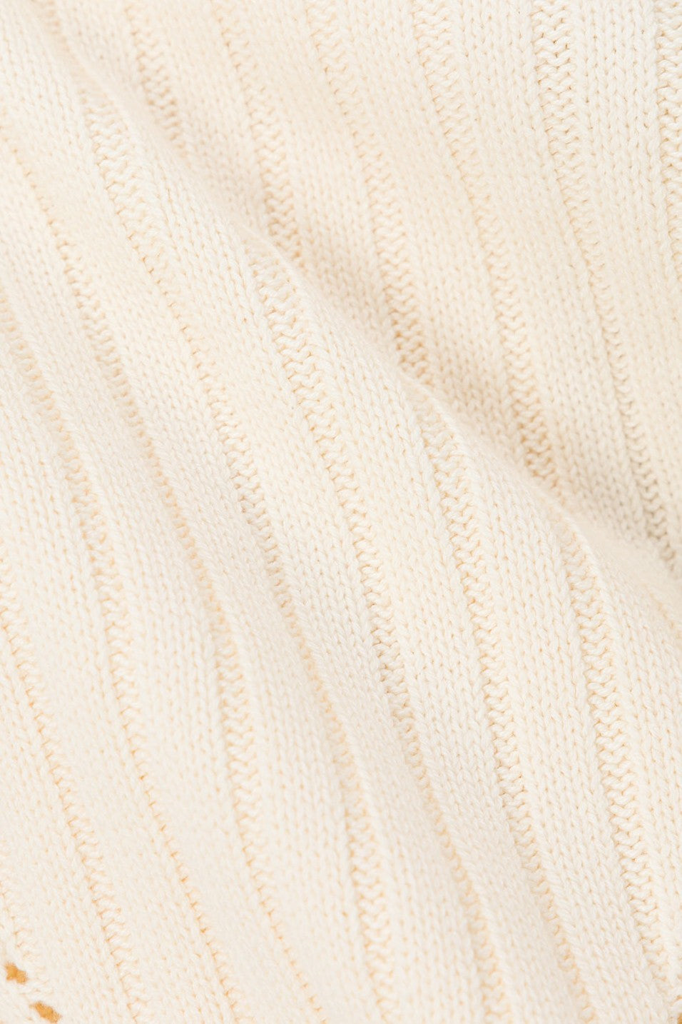 Cream mini dress with a strapless neckline, side view
