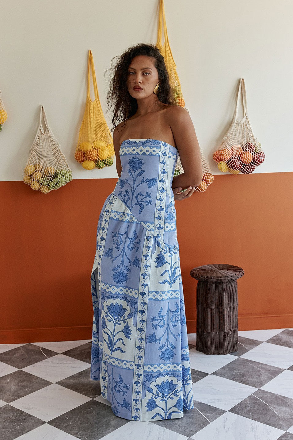 Blue maxi dress with a strapless neckline, side view