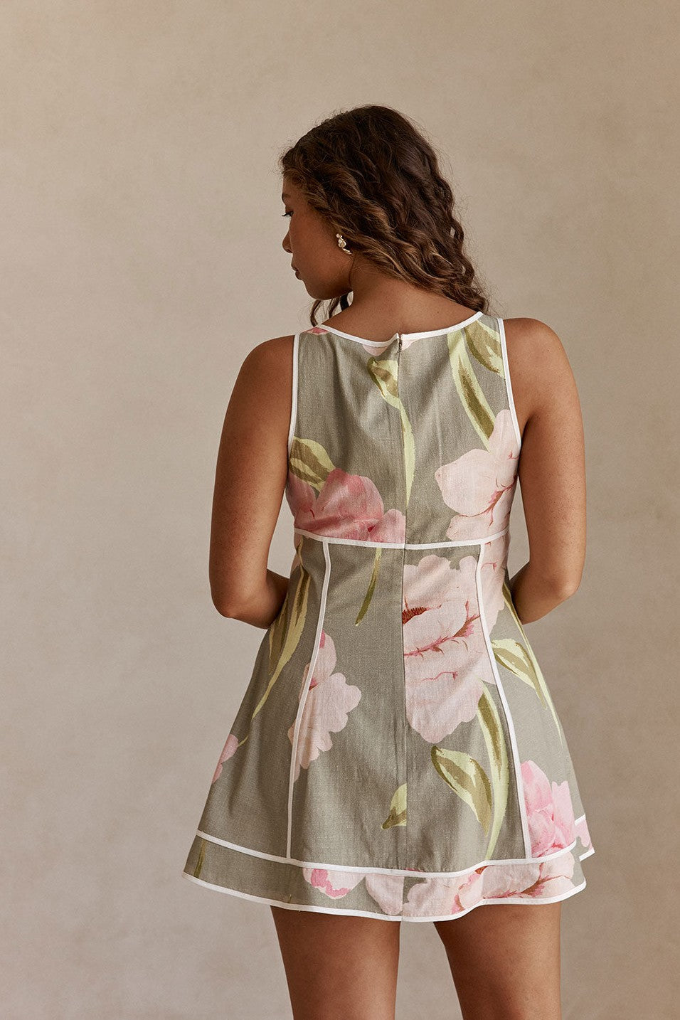 Green mini dress with a boat neckline, back view