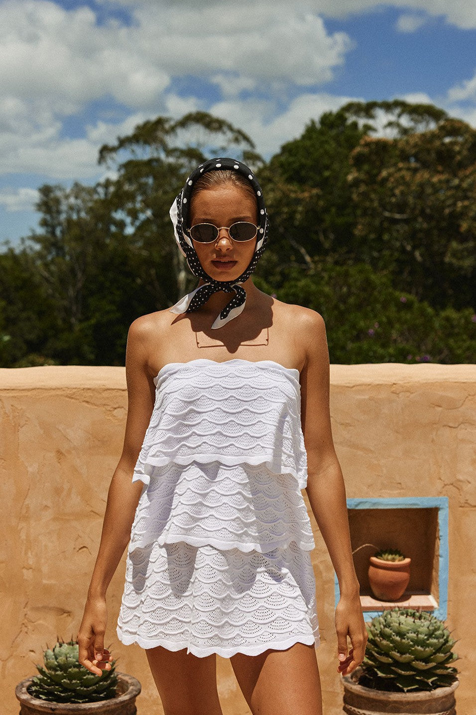 White mini dress with a strapless neckline, detail view