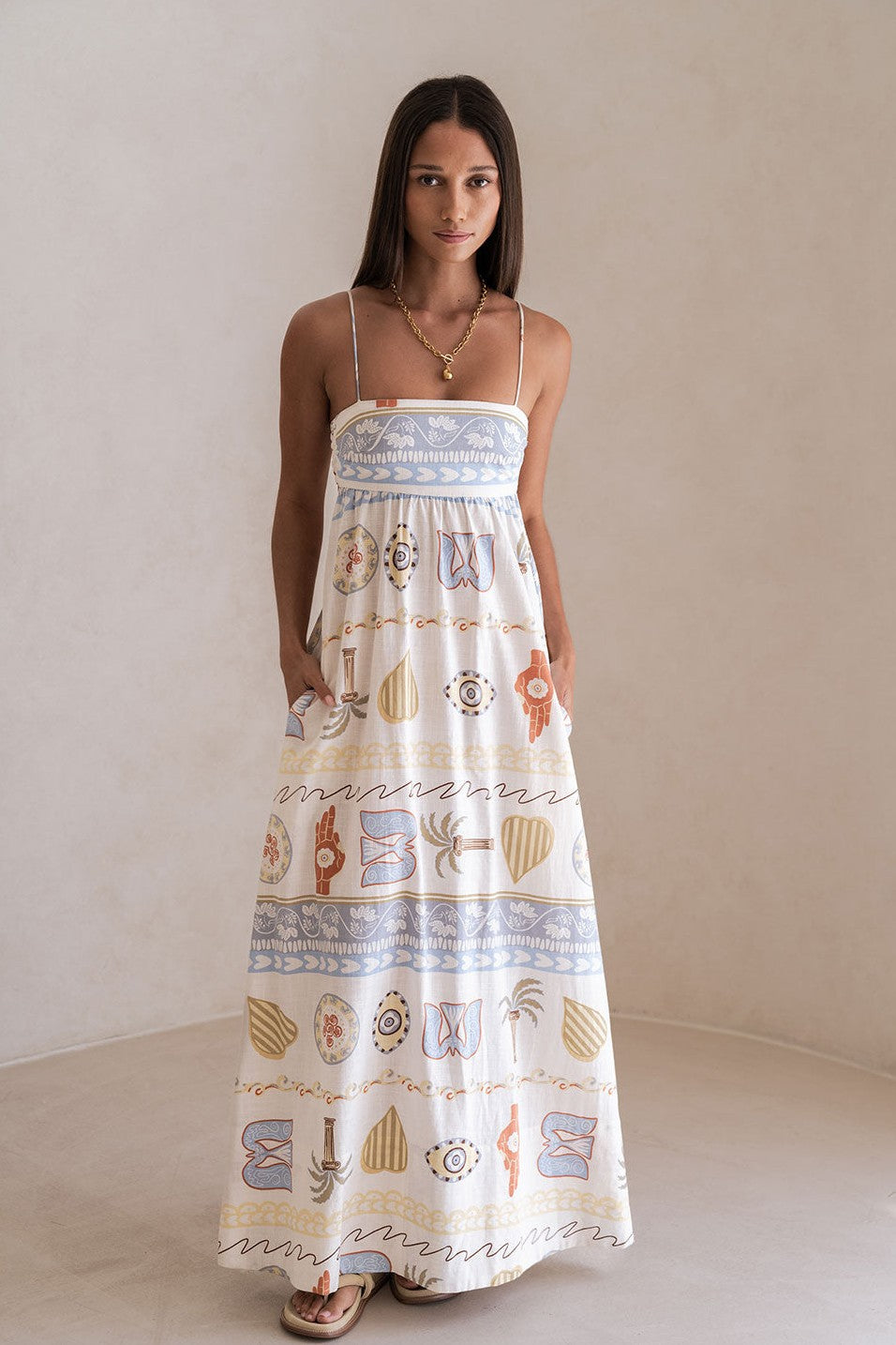 Blue maxi dress with a round neckline, styled on model
