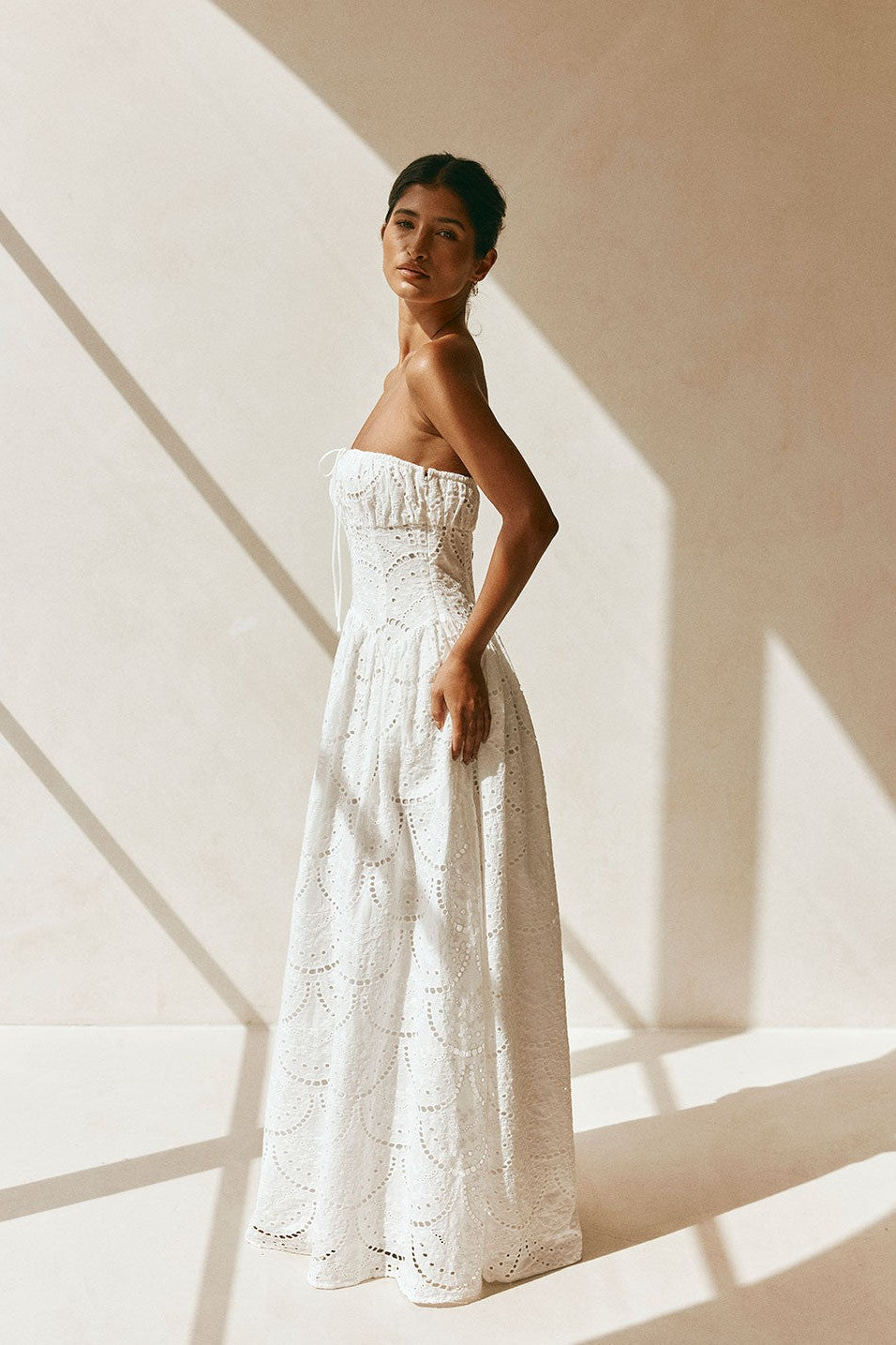 White maxi dress with a strapless neckline, back view