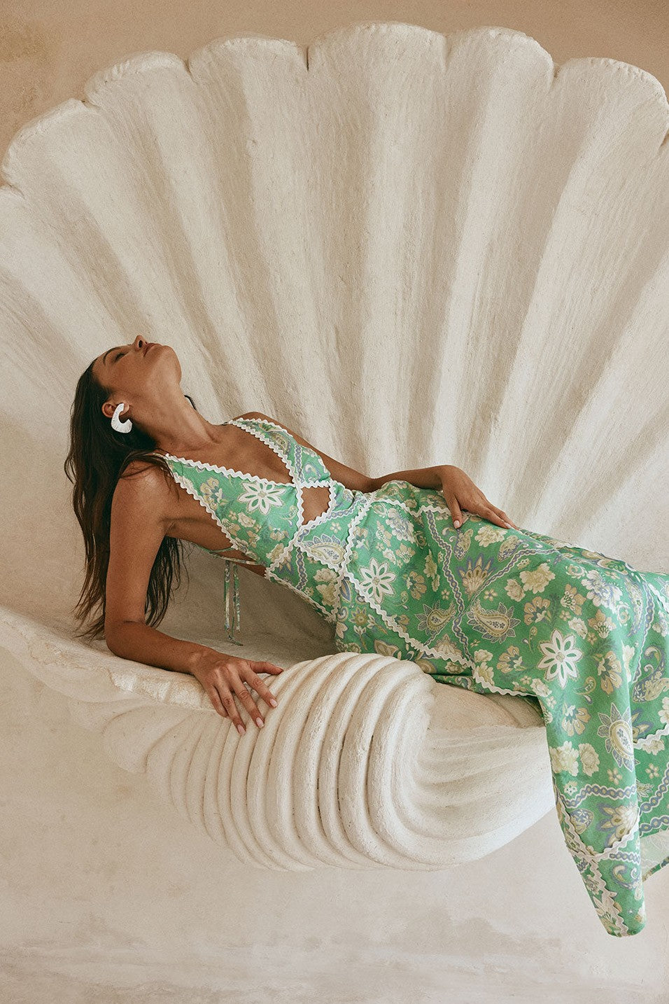 Green maxi dress with an open back, side view