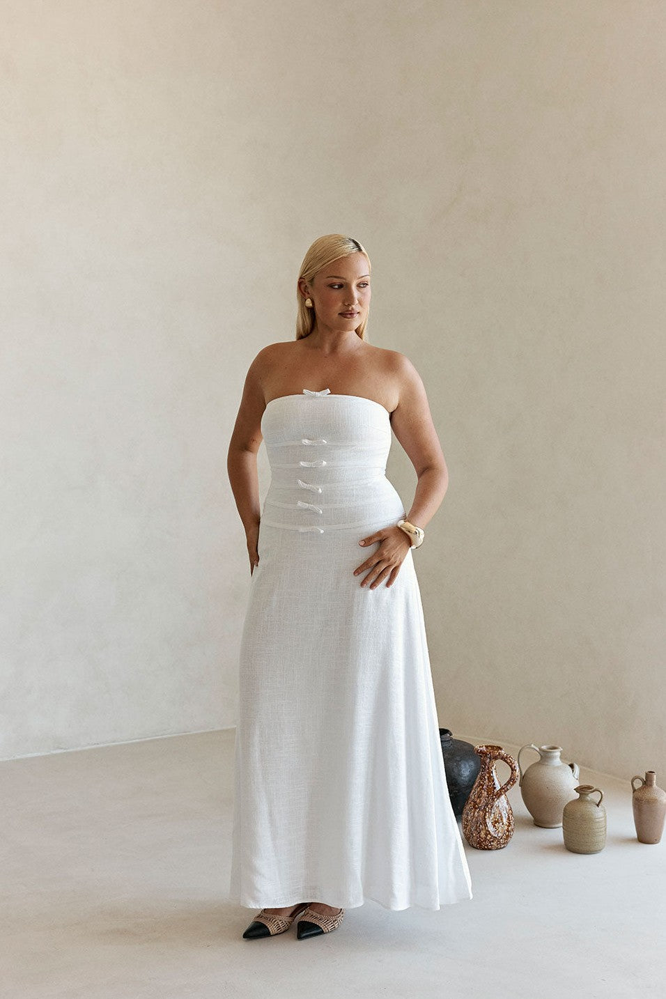 White maxi dress with a strapless neckline, detail view