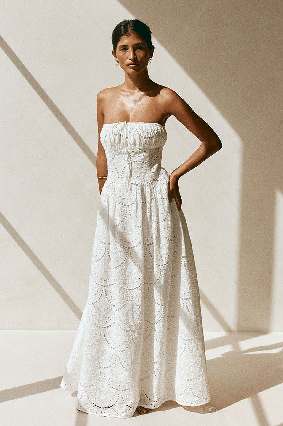 White maxi dress with a strapless neckline, detail view