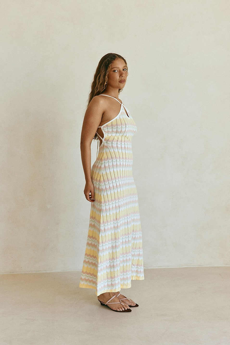 Yellow maxi dress with a halter neckline, detail view