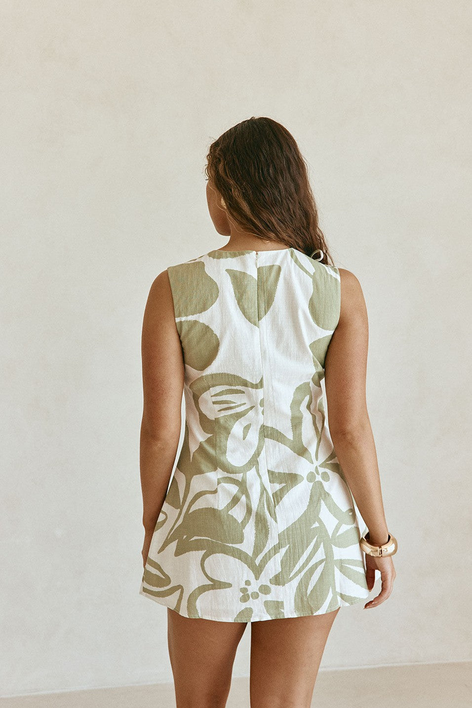 Green mini dress with a round neckline, front view