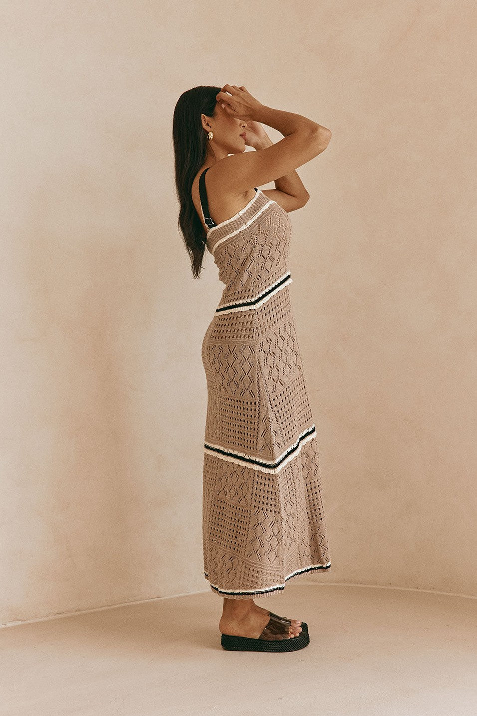 Brown maxi dress with an A-line skirt, styled on model