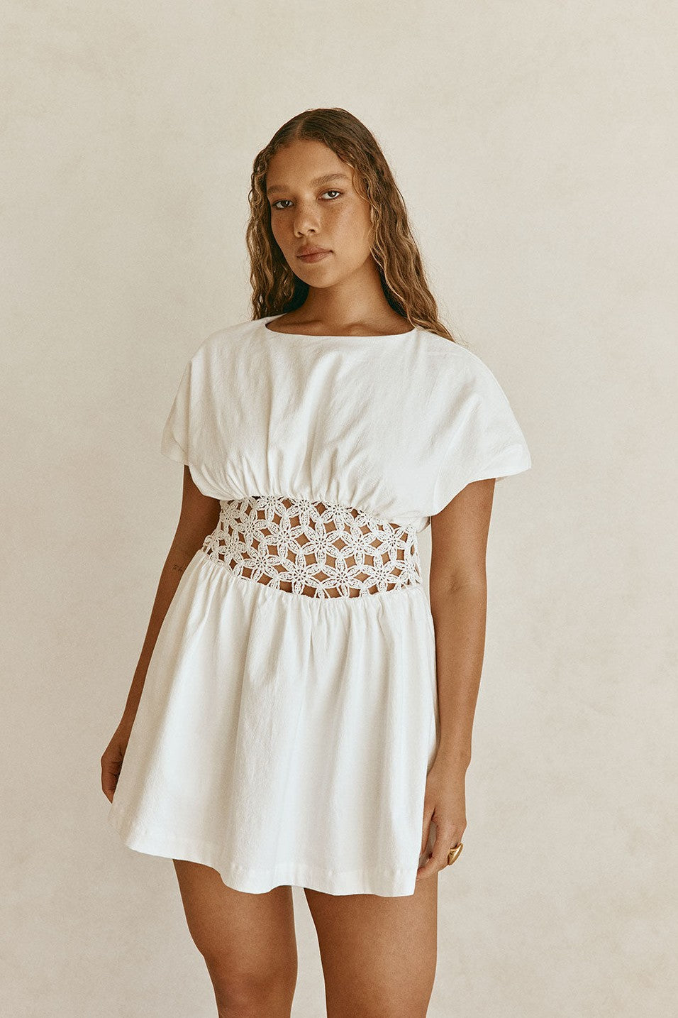 White mini dress with a boat neckline, back view