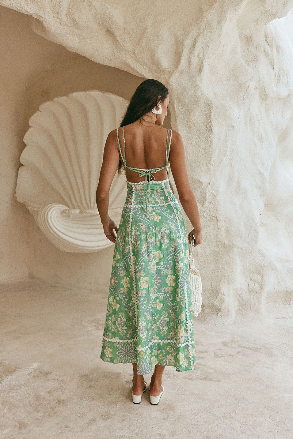 Green maxi dress with an open back, side view