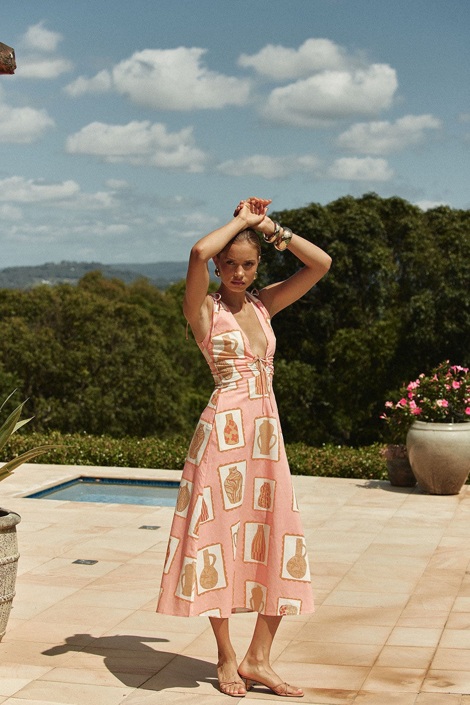 Pink midi dress with a V neckline, front view