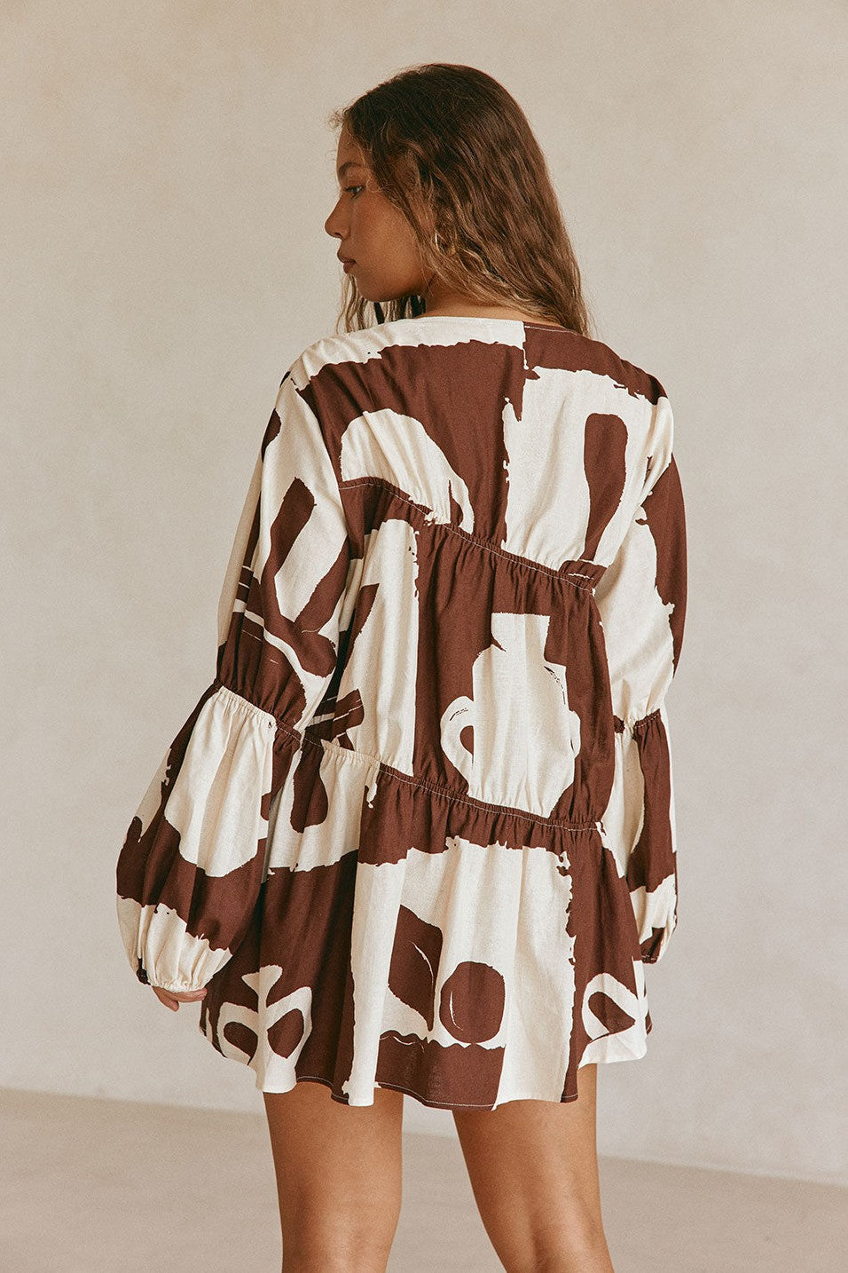 Brown mini dress with a V neckline, front view