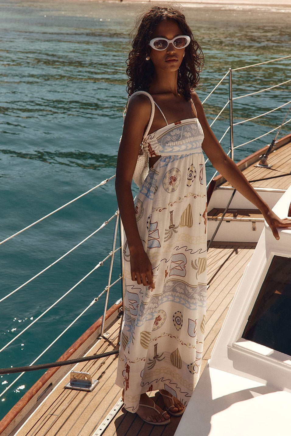 Blue maxi dress with a round neckline, side view