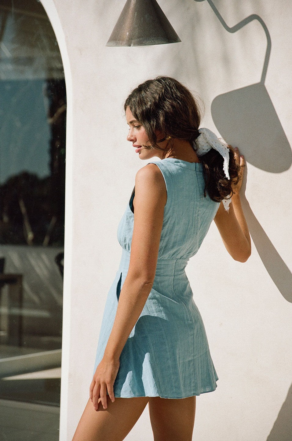 Blue mini dress with a plunging V neckline, detail view