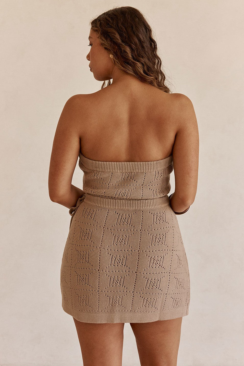 Brown mini dress with a wrap silhouette, front view