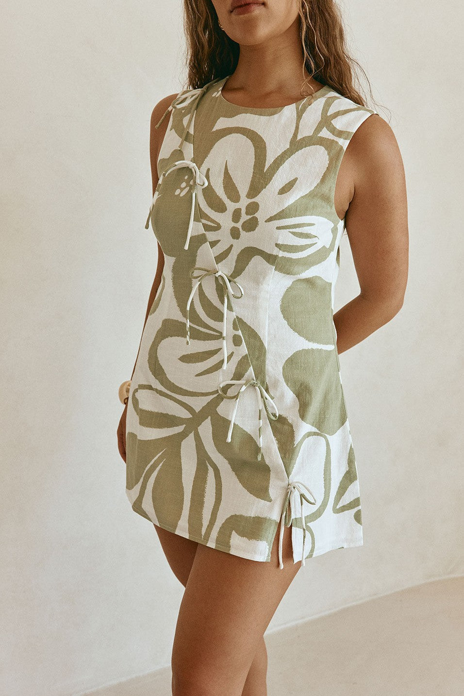 Green mini dress with a round neckline, back view