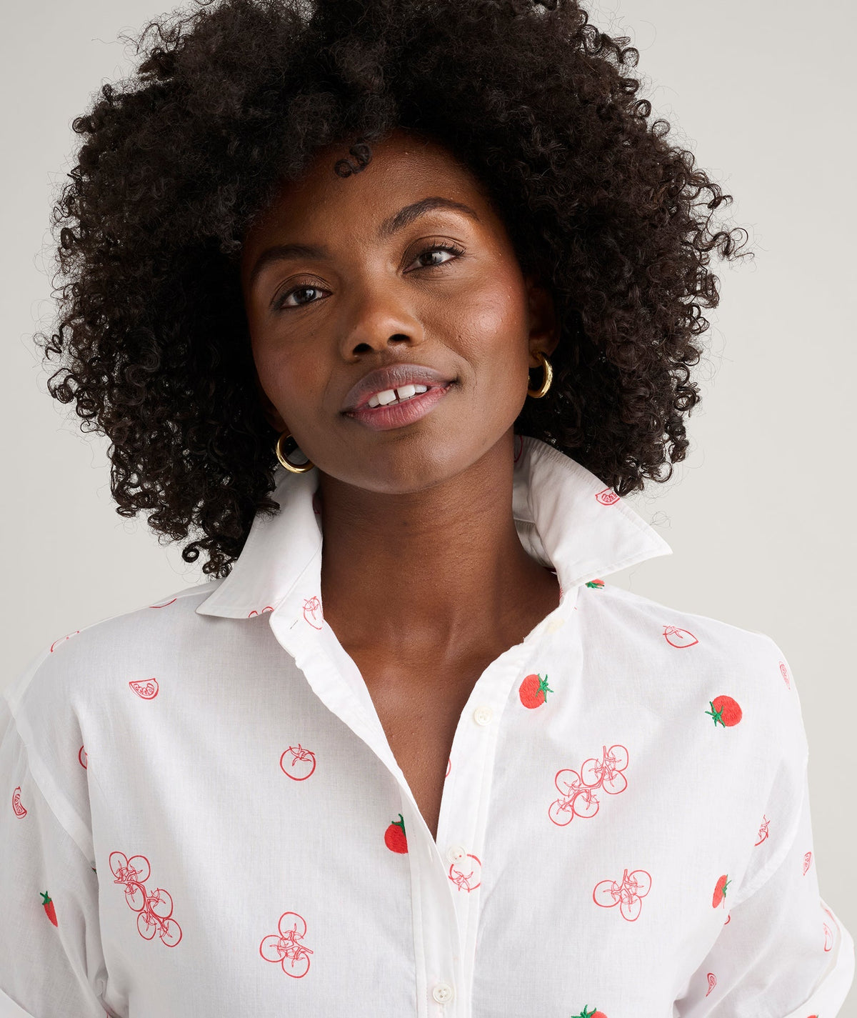 white embroidered tomato print shirt, side view